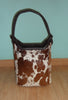 A cowhide bucket bag is a versatile and stylish option for any woman. They are roomy enough to carry all your essentials, but also look great with any outfit.