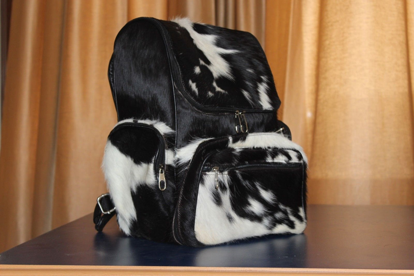 Such a wonderful cowhide weekender backpack that can be used as hospital bag when your kid is born a great addition to your southern style