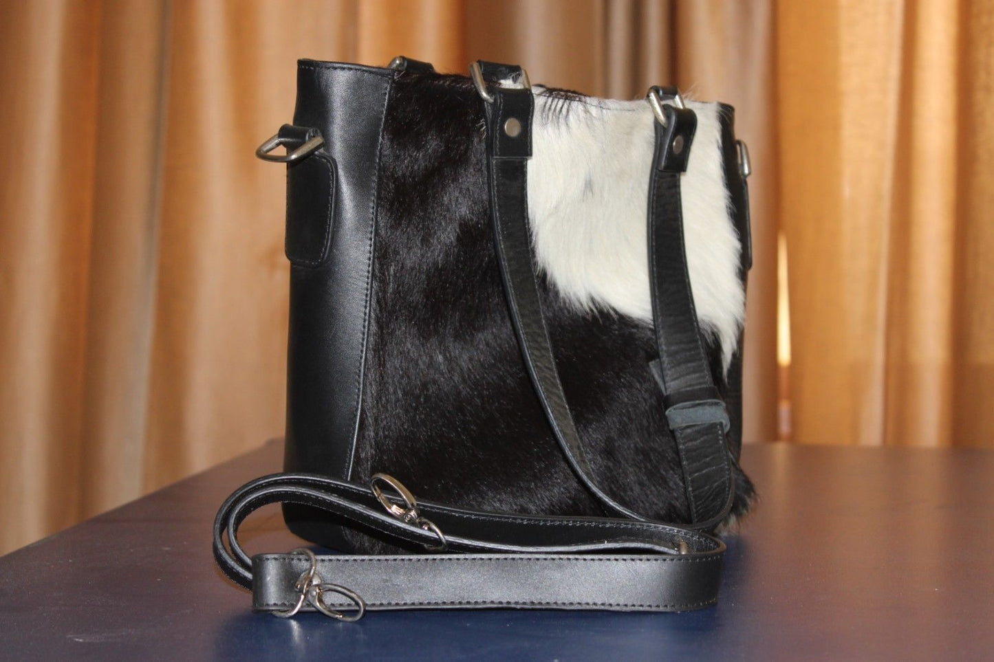A calf hair crossbody bag is the perfect everyday bag for women who want to keep their hands free. Whether you’re running errands or out for a night on the town, a crossbody bag will keep your belongings close and your hands free.