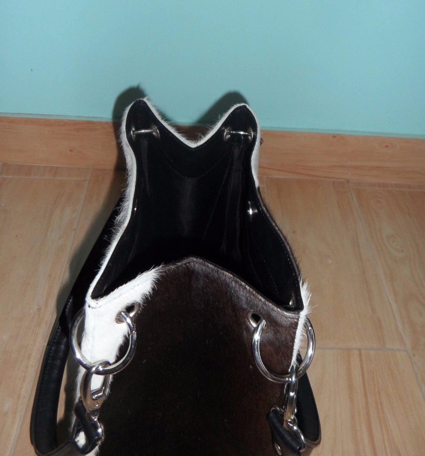 A cowhide bucket bag is the perfect everyday bag. Made from real cow skin, it is soft, smooth, and custom made to fit your needs.