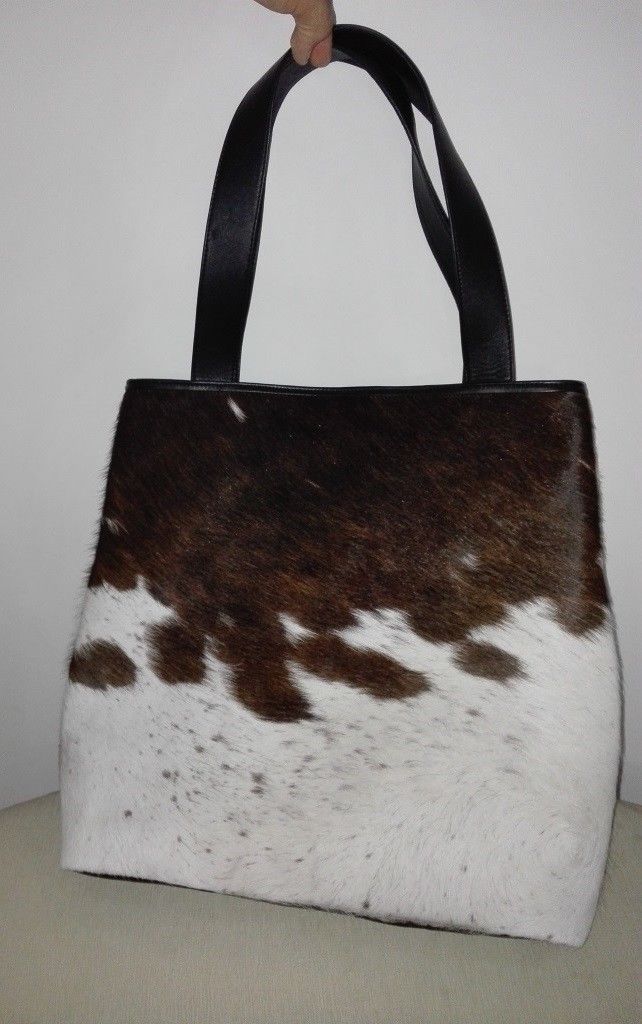 All our cowhide bags are custom made to order if you wish to add any specifications please feel free to email me.
