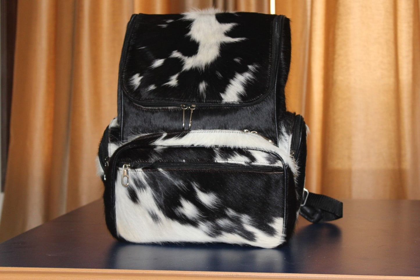 Absolutely gorgeous hair on cowhide purse made from real fur, the bag looks even better in person! So soft yet sturdy with a shoulder strap.