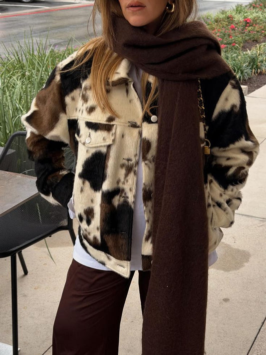 Women cowhide trench coat with natural cow fur texture in black brown white. Statement outerwear designed for everyday and winter styling.
