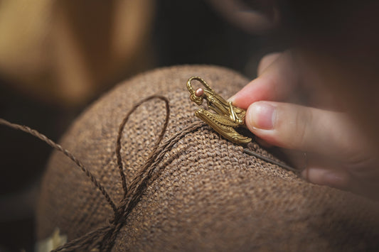 a close up of a person holding a piece of cloth