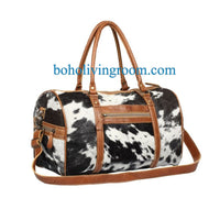 Invest in convenience with our cowhide overnight bag, crafted to endure your travels with ease.