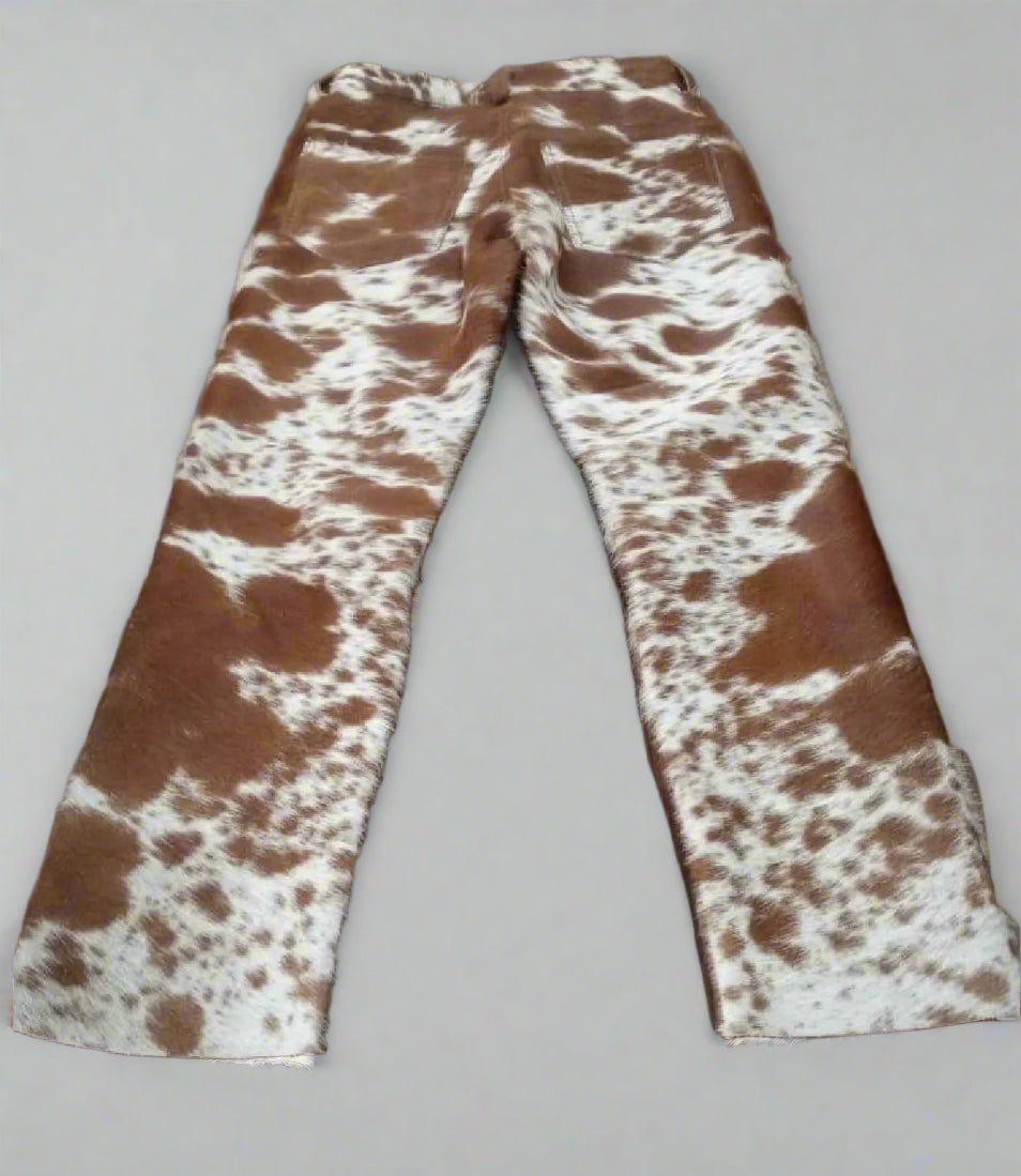 Cow print pants made from authentic hair-on cowhide, tailored for rodeo events, country weddings, and rustic fashion enthusiasts who prefer real cowhide texture.
