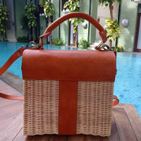 Handwoven rattan shoulder bag with leather