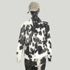 Black white cowhide fur coat for men and women. Genuine cowhide jacket perfect for rodeo, western wear, and winter warmth with unique hide patterns.