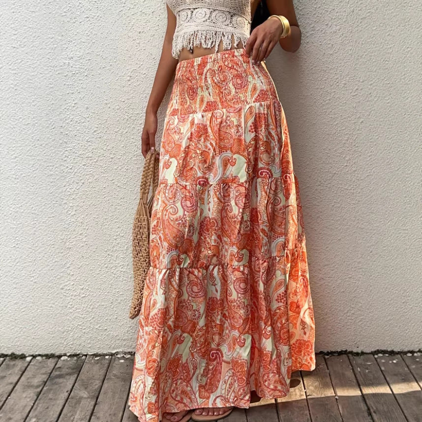 Smocked waist maxi skirt with tiered paisley print