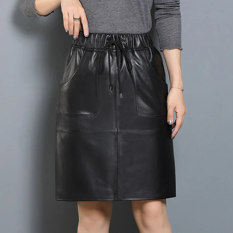 Black elastic waist leather midi skirt with pockets