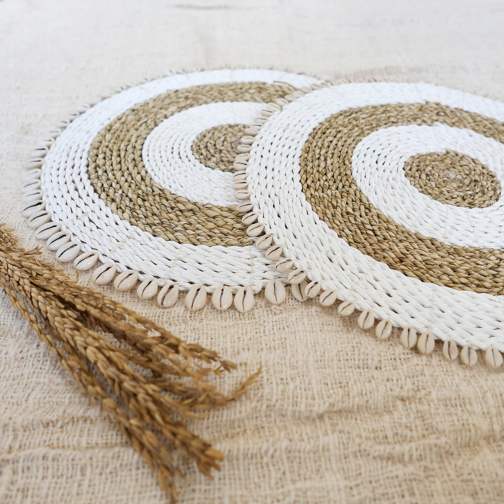 Natural seagrass placemats with cowrie shells