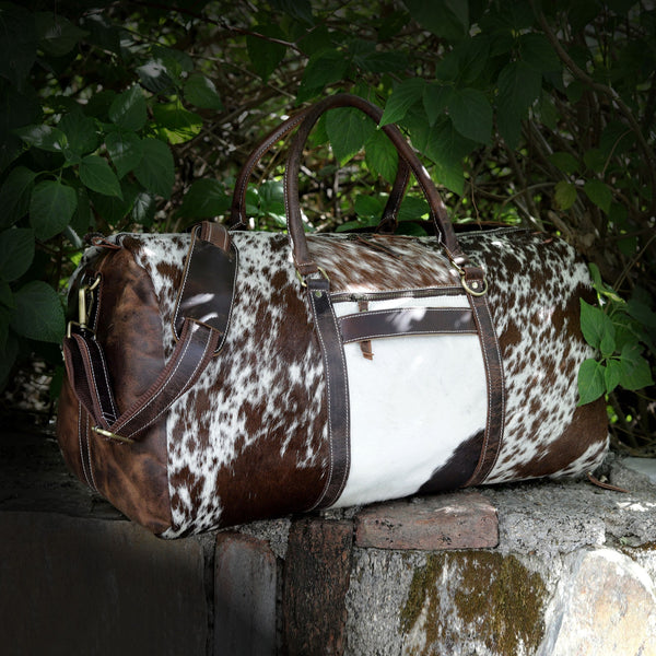 Set forth in style with a premium cow hide duffle bag, blending rugged durability with timeless elegance.