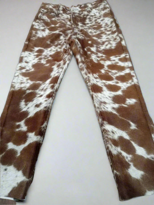 Genuine cow skin trousers made with real hair-on-hide, ideal for cowboy styling, country living, and standout western looks for both men and women.

