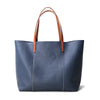 Premium women leather office tote with laptop space, top handles, and structured cowhide design for work and everyday essentials.

