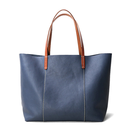 Premium women leather office tote with laptop space, top handles, and structured cowhide design for work and everyday essentials.

