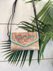 tooled leather hair on hide crossbody handbag