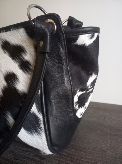 Black and white cowhide shoulder purse