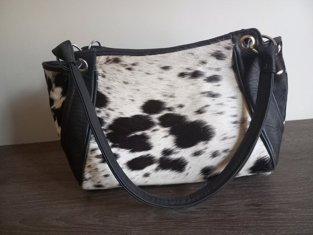 Black and white cowhide shoulder purse