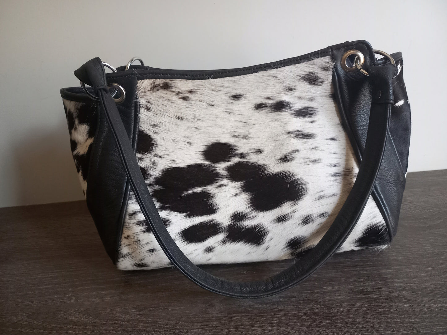 Black and white cowhide shoulder purse