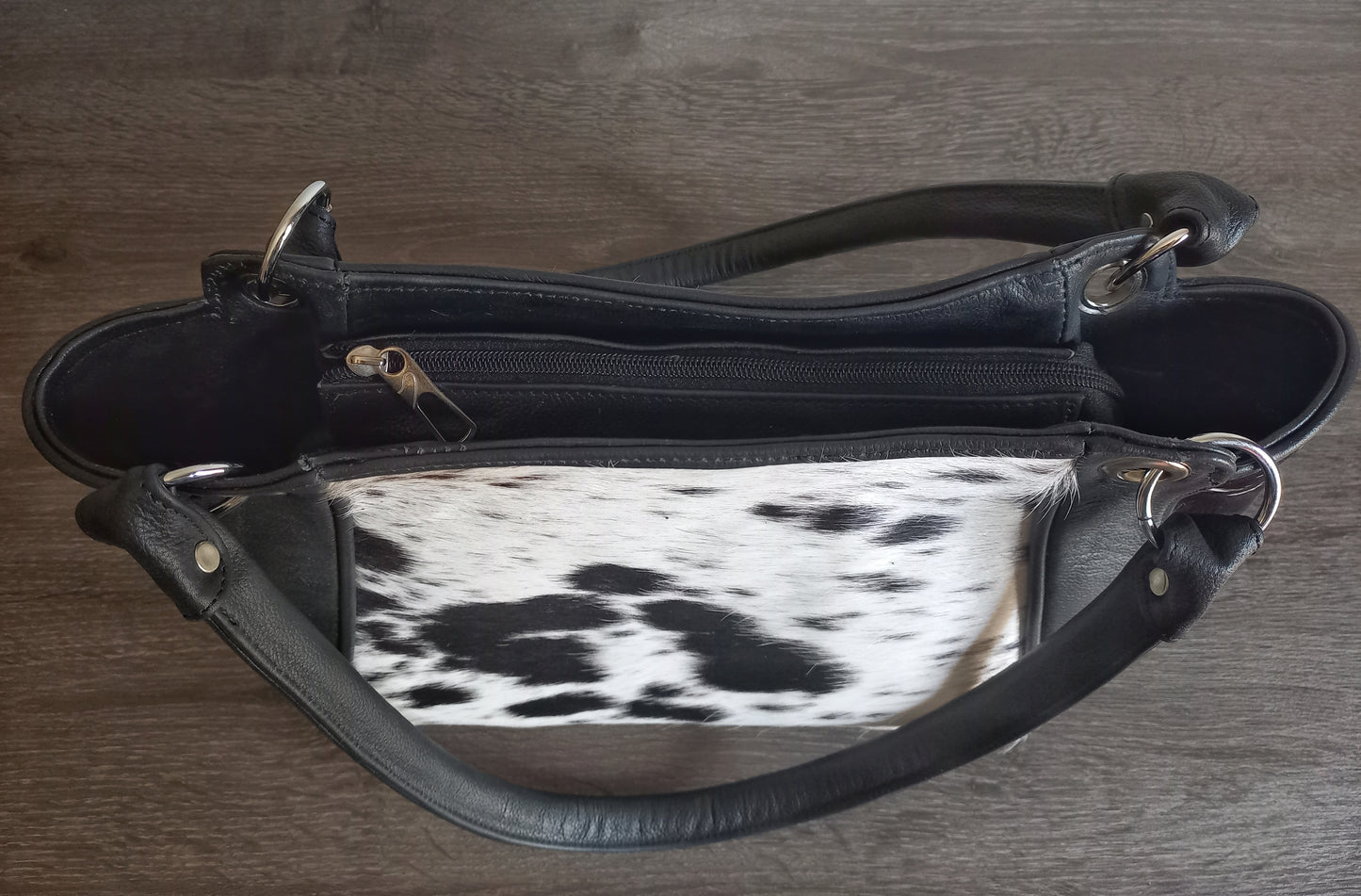 Black and white cowhide shoulder purse