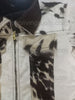 Black and white cowhide leather jacket made from real cow skin. Unisex fit with unique patterns — perfect for ranch life, outdoor rodeos, and western outfits.

