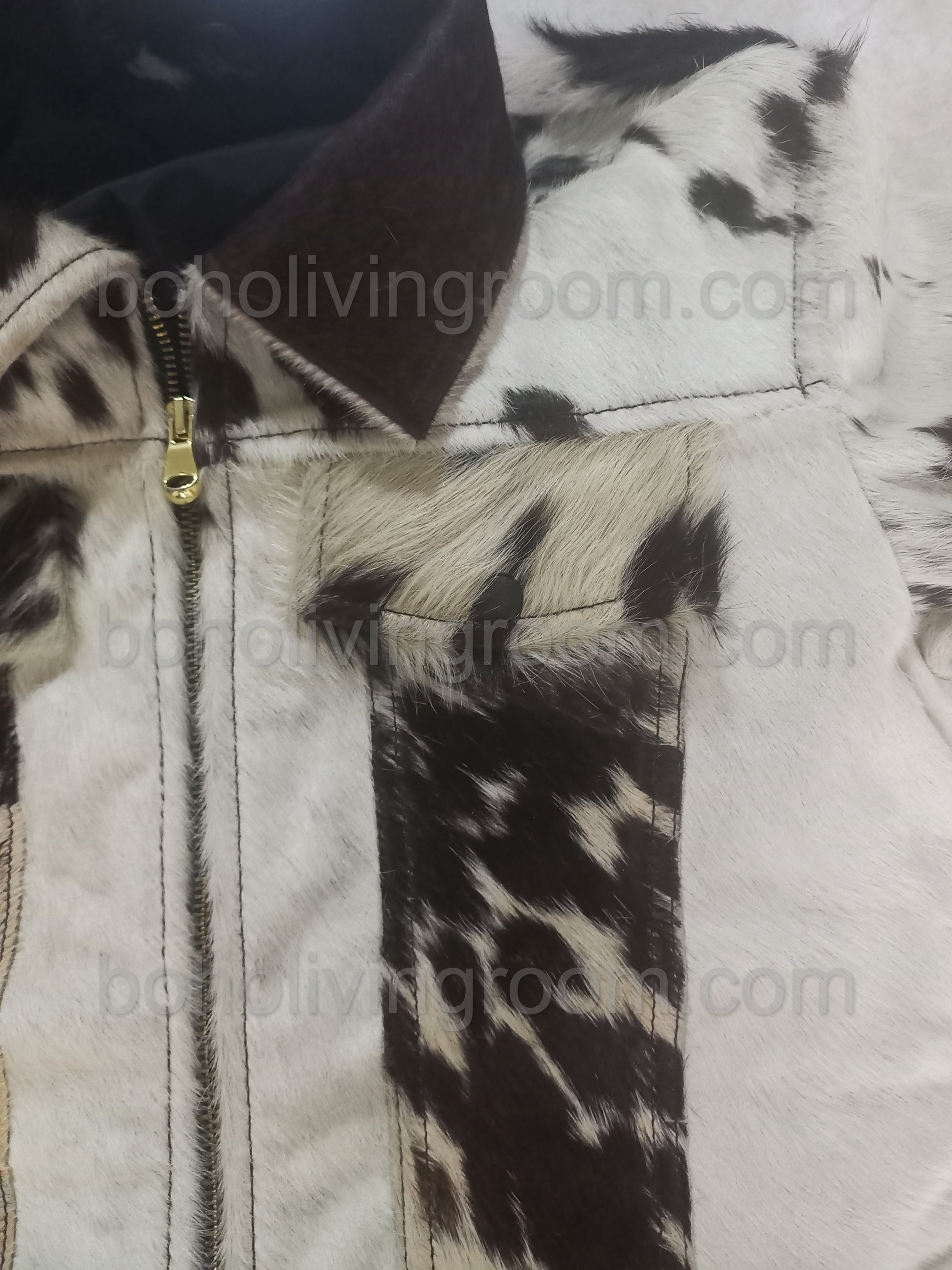 Black and white cowhide leather jacket made from real cow skin. Unisex fit with unique patterns — perfect for ranch life, outdoor rodeos, and western outfits.


