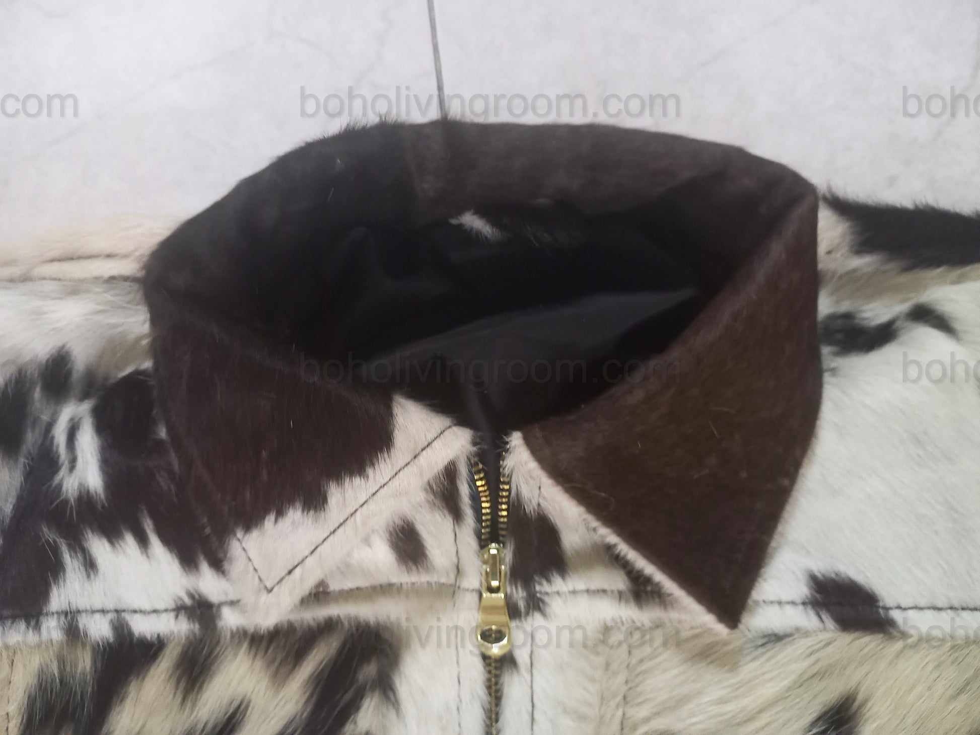 Genuine cow hide jacket with a spotted hair-on-hide finish. Built for men and women who prefer real western wear with bold texture and everyday comfort.

