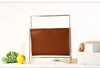 Nordic leather and iron sling magazine rack