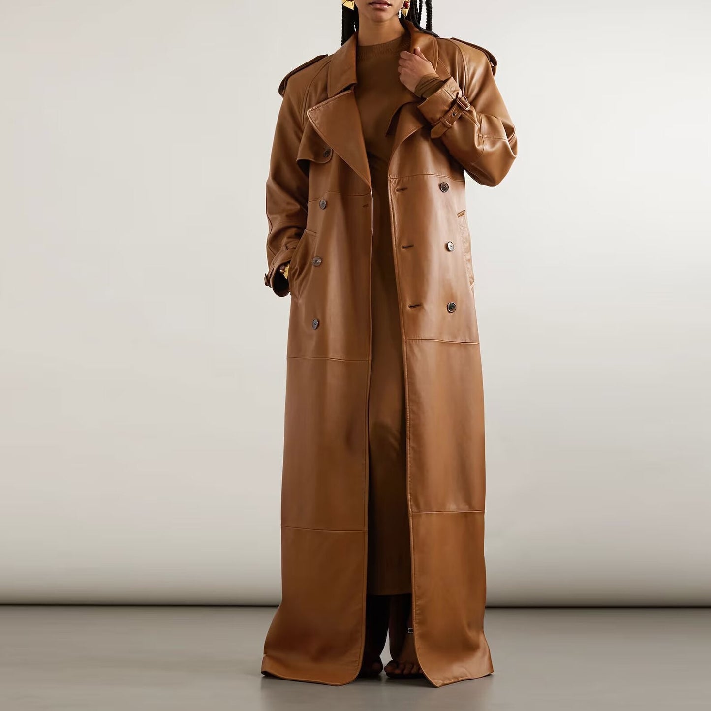 Step into timeless fashion with this long leather trench coat for women, featuring a sleek design and rich detailing that elevates any outfit effortlessly.