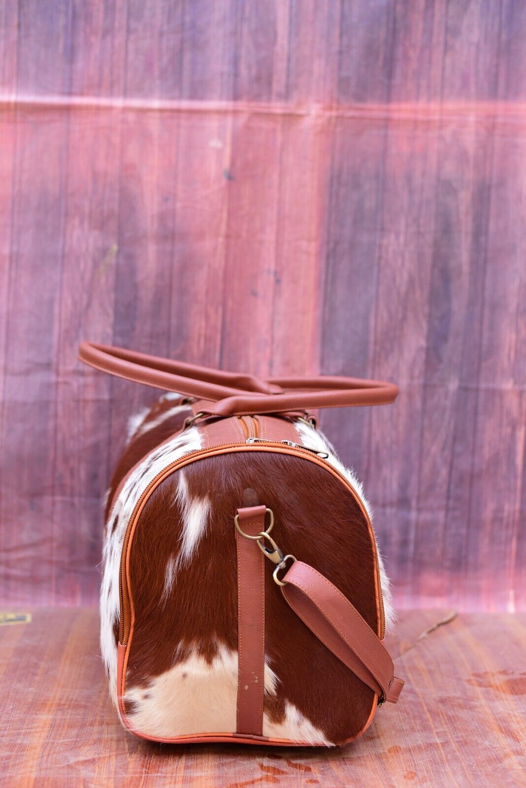 Rugged, handcrafted cowhide weekender. Southern style for trips, gym, rodeo. Built to last.