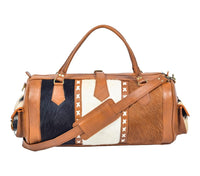 Experience luxury travel with this cow skin weekender bag, crafted for your adventures.