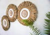 White seagrass beads round wall decor