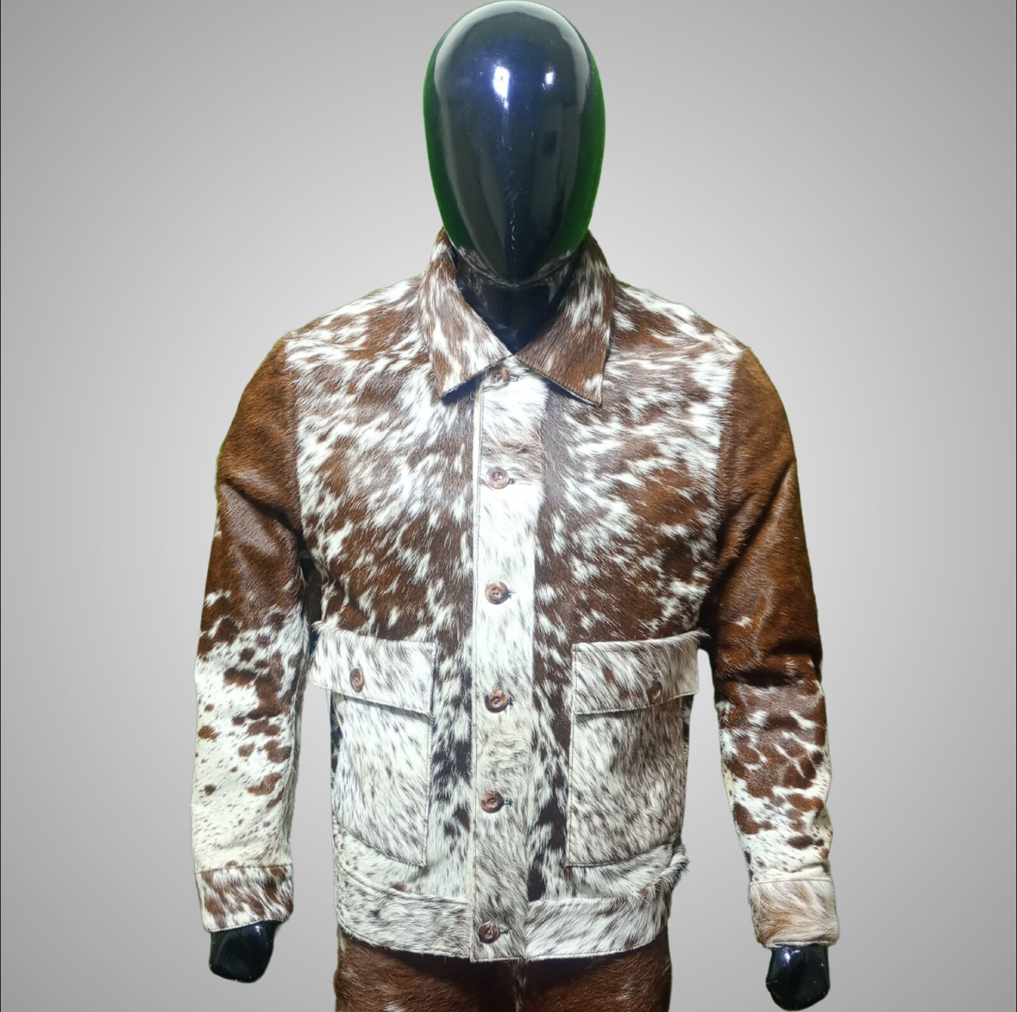 Cowhide fur jacket with real cow print skin in black, white, and brown tones. A rugged hide jacket made for cowboys, ranch wear, and western-inspired mens looks.

