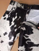 Men cow fur shorts made from genuine hair-on hide. Tricolor blend, bold texture, and seamless back panel. Each pair is one of a kind.
