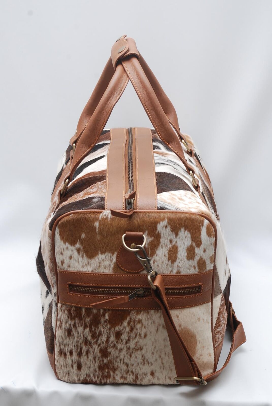 From urban adventures to countryside escapes, this cowhide duffle bag is your go-to companion for every journey.