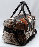 Experience the joy of travel with this cowhide travel bag, designed for the discerning adventurer in you.