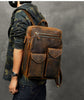 dark brown leather backpack