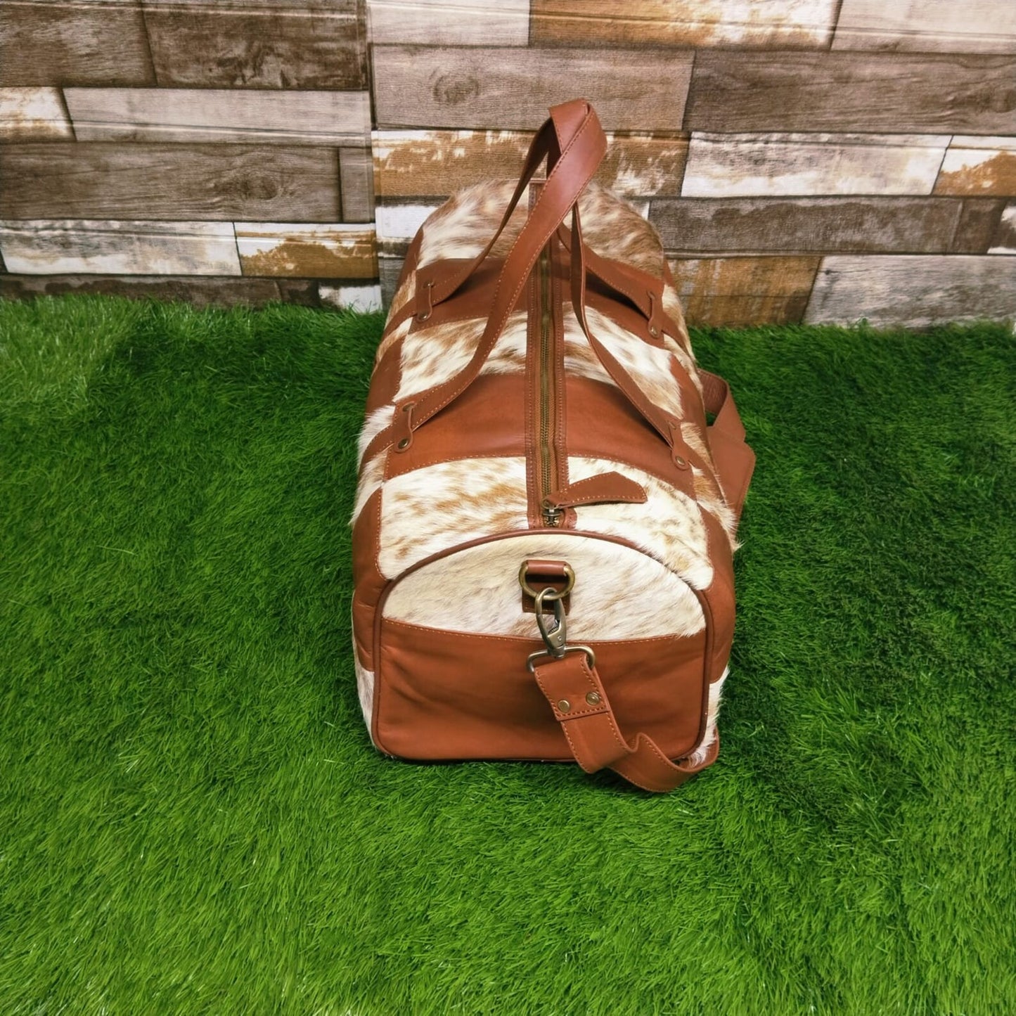 Elevate your fitness regime with this cow skin gym bag, crafted to keep your essentials organized in sleek style.