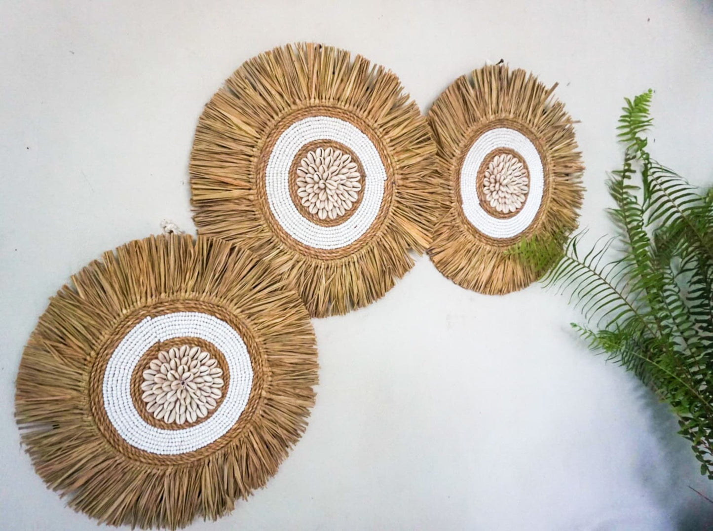 White seagrass beads round wall decor