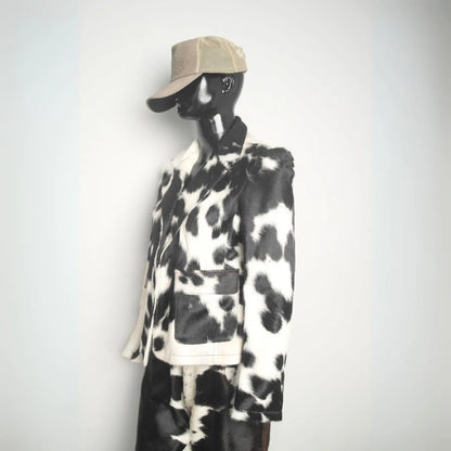 Premium cowhide leather jacket featuring natural black white hide. Rodeo-ready winter coat for men and women, designed for ranch and country lifestyle.
