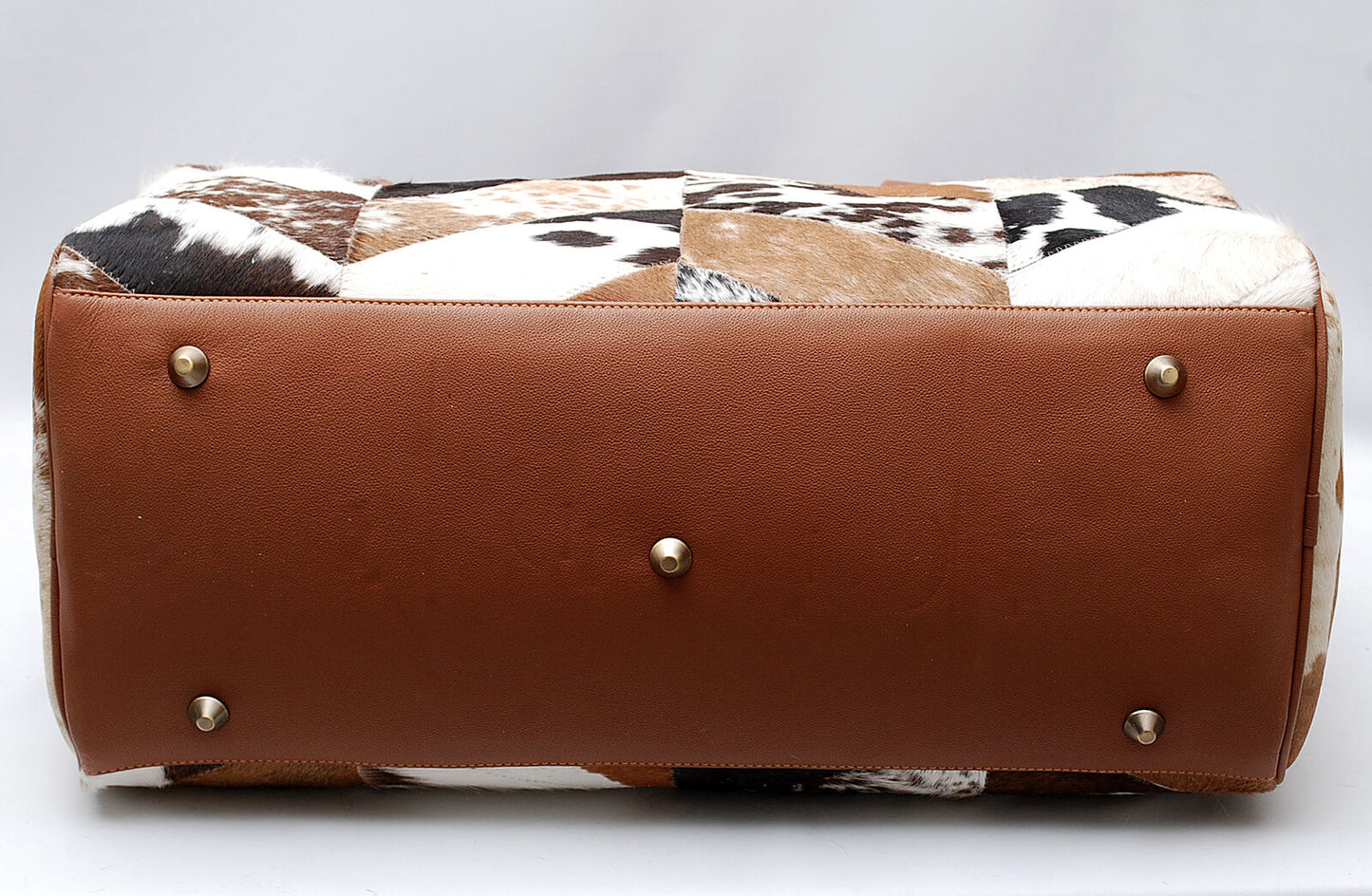 Stylish cowhide travel companion for adventures.