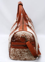 Effortlessly chic, this cowhide overnight bag is designed to accompany you on every journey, near or far.