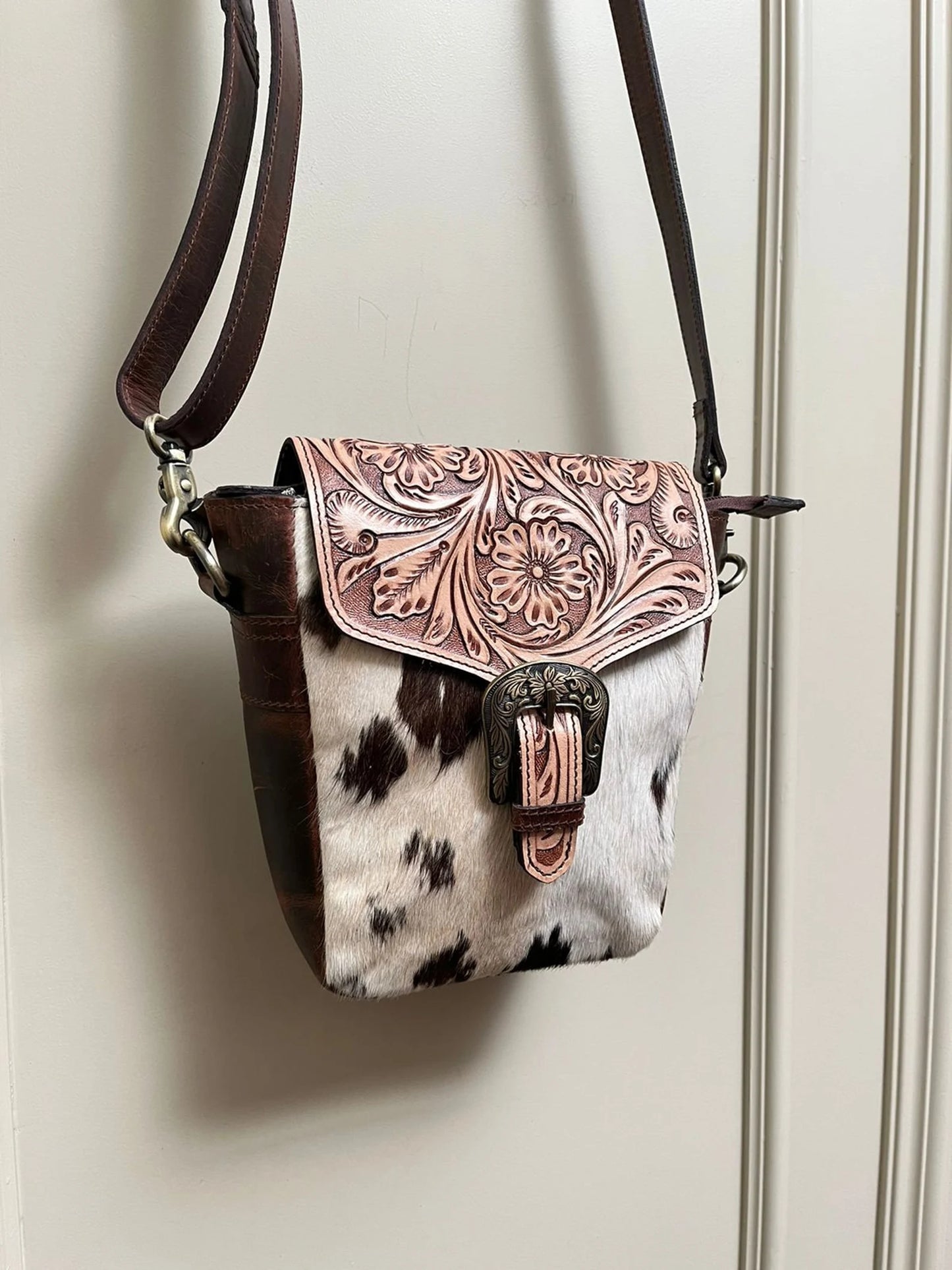 Cowhide crossbody bag with tooled leather