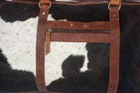 Travel in sophistication with a sleek cow fur weekender bag, designed for the modern traveler's needs.