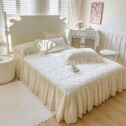 Quilted Bedspread with Lace Ruffled Bed Skirt and Floral Embroidery