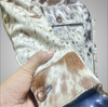 Tricolor cowhide fur coat with button-up front and natural pattern. Real cow skin jacket for men featuring patch pockets and rodeo-ready cow print hide detail.

