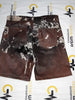 Cow print shorts made from real cowhide for unique western outfits. Tricolor tones for cowboy events, rodeo fashion, and rustic summer wear.

