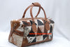 Embark on a voyage of elegance with this cowhide travel bag, designed to elevate your adventures with timeless style.