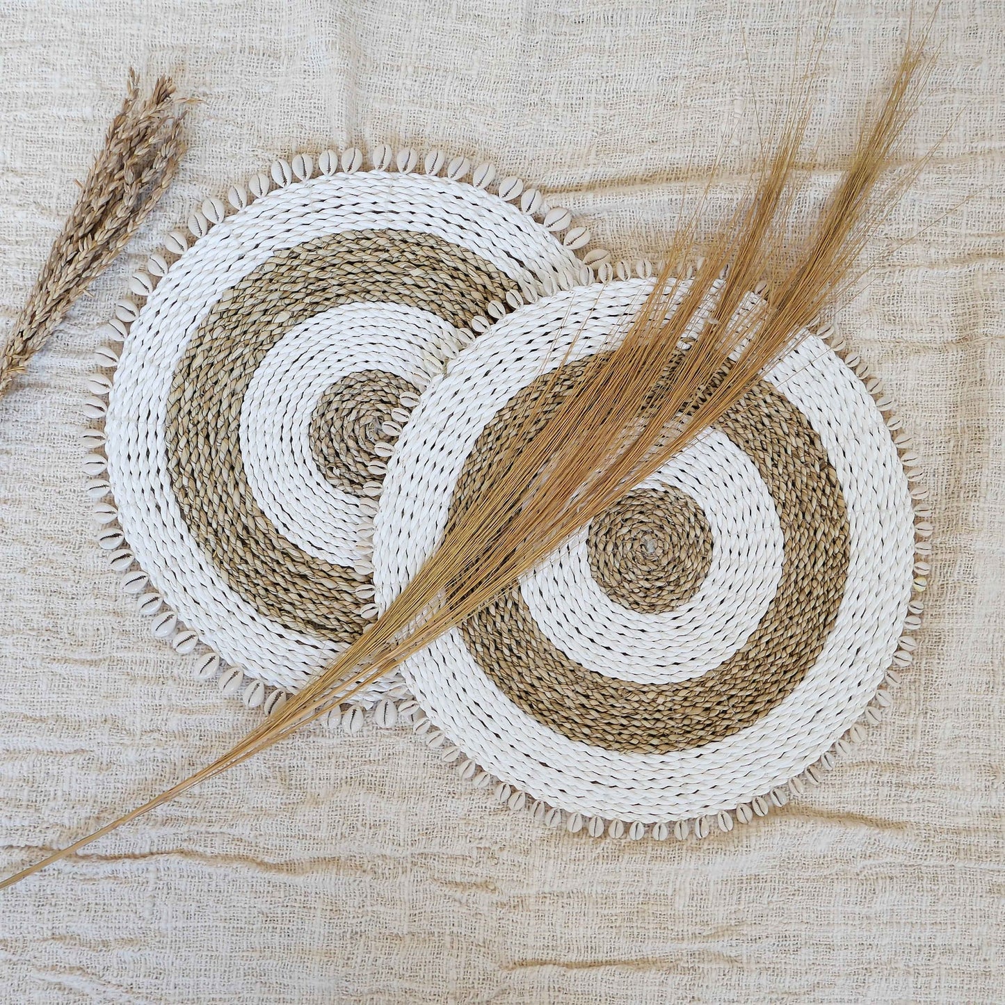 Natural seagrass placemats with cowrie shells