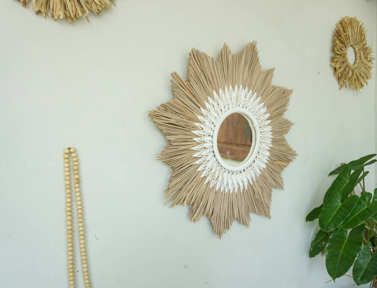 Sunburst shape raffia cowrie sea shells mirror